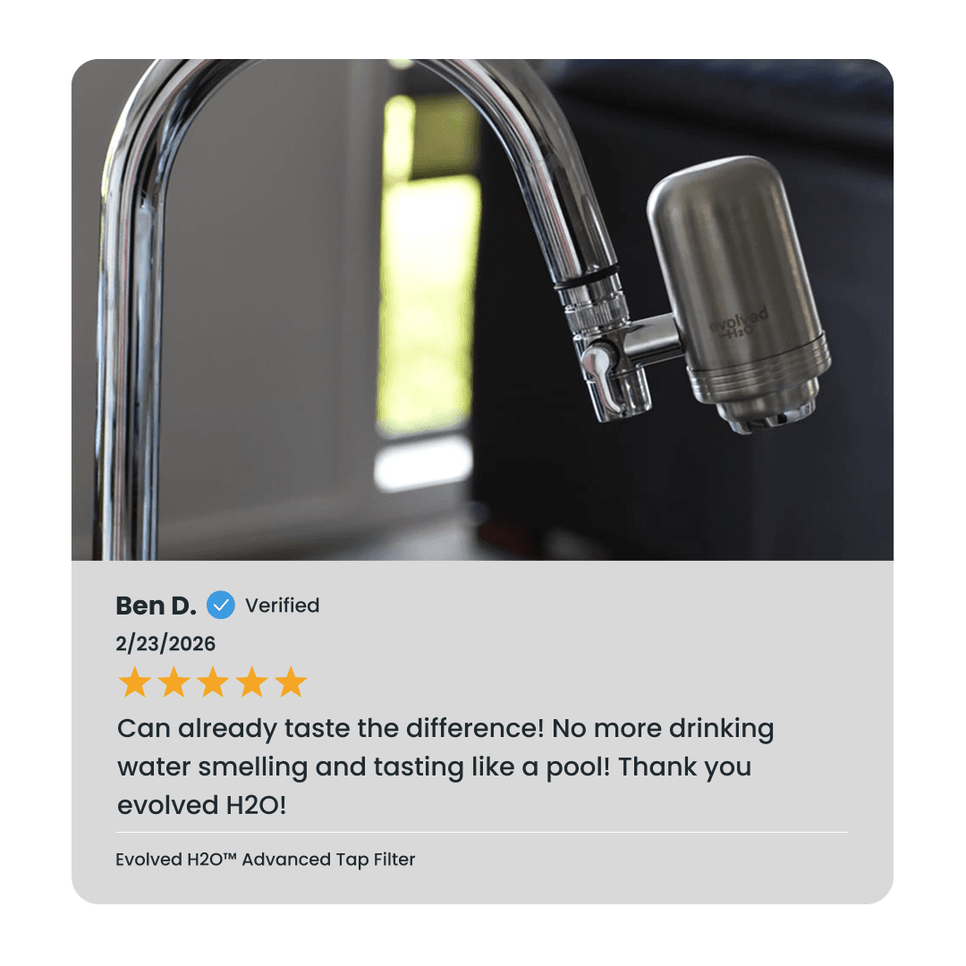 Evolved H2O Advanced Tap Water Filter attached to a curved kitchen faucet with verified customer review