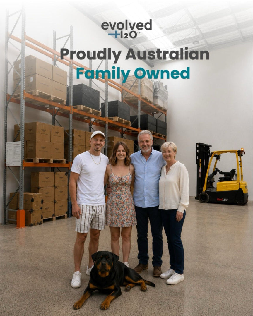 Evolved H2O family team standing with their dog inside an Australian warehouse