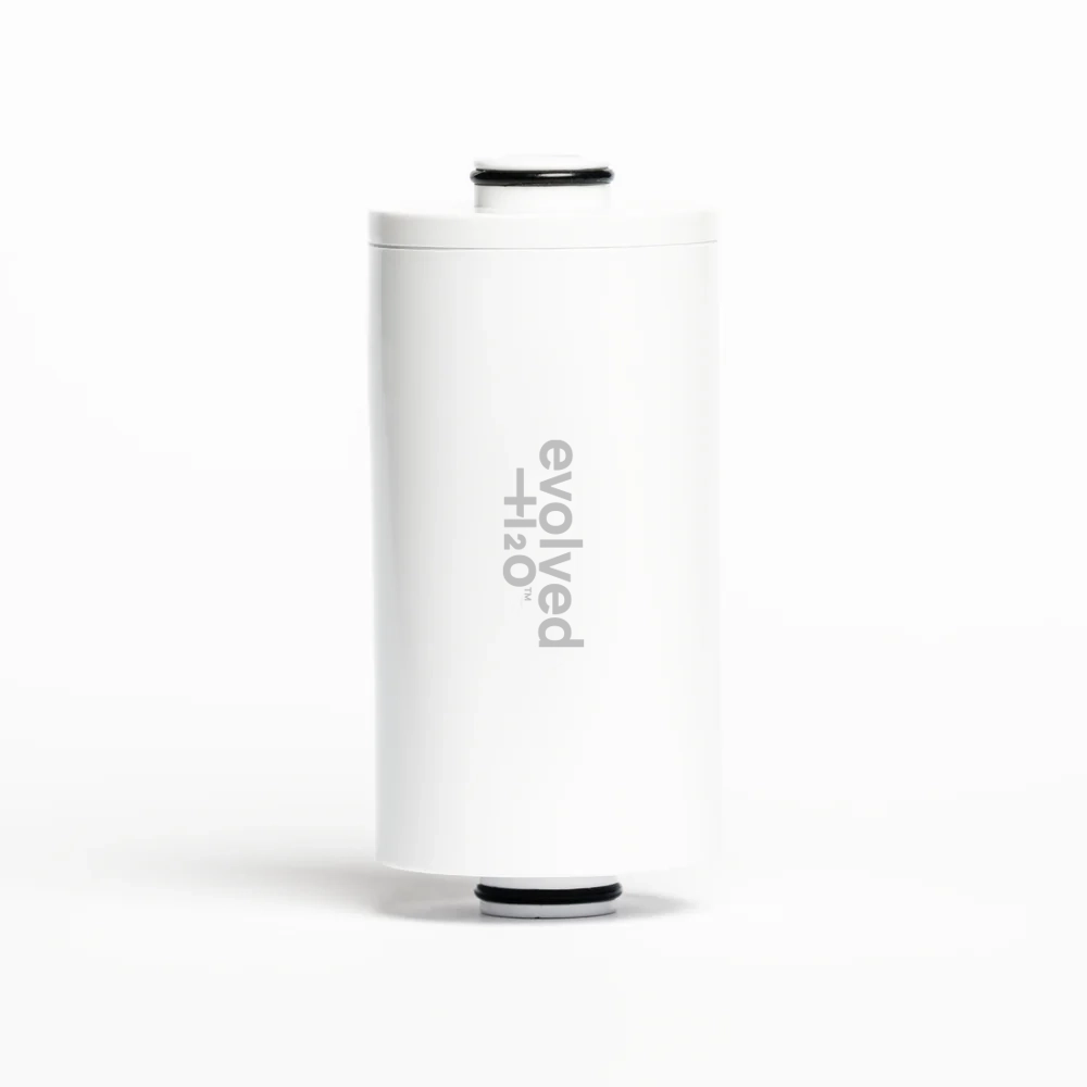 White Evolved H2O shower filter replacement cartridge standing upright against a plain background.